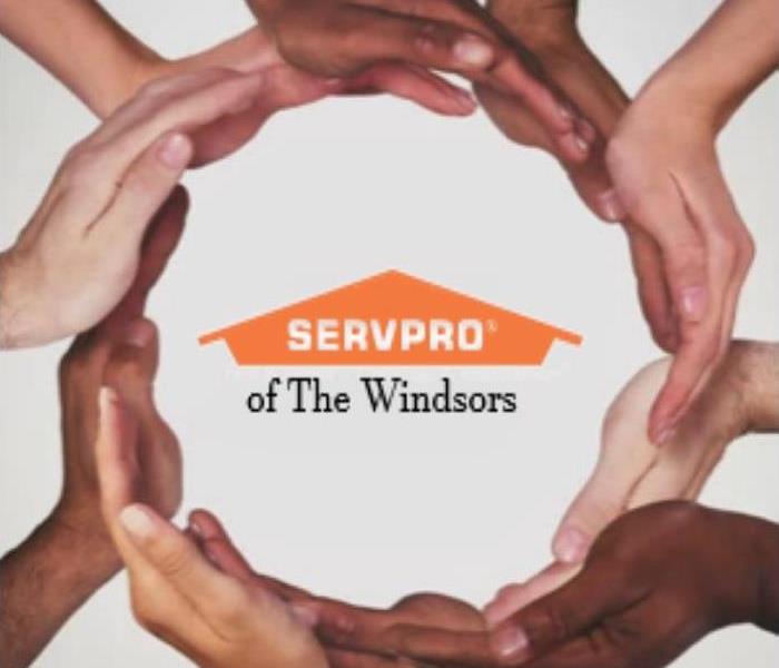 hands that are different shades of skin colors circling around SERVPRO Logo