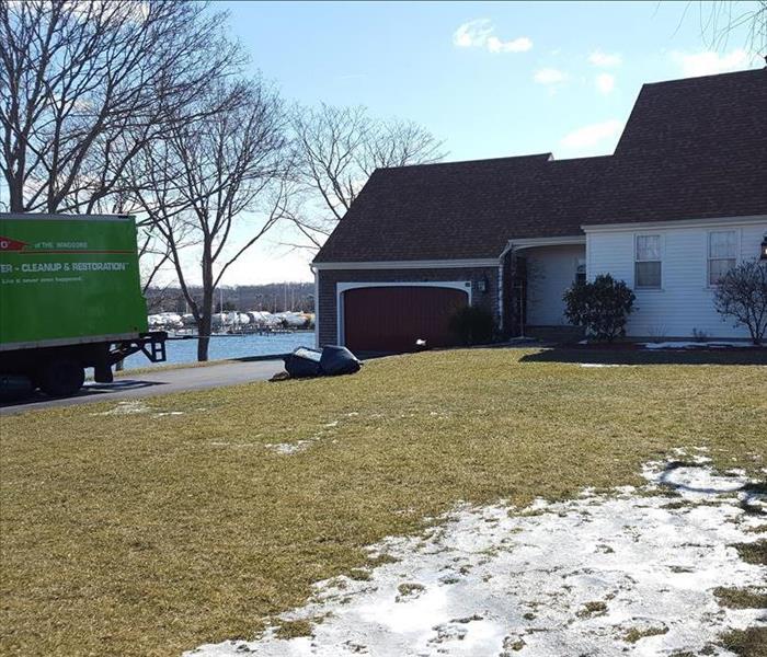SERVPRO windsors in stonington, SERVPRO box truck in drivewa of water front property, house, driveway, front lawn