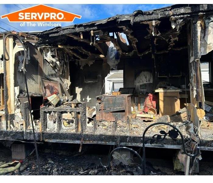 Interior of trailer after fire- charred structure, fire damage, servpro, damaged contents