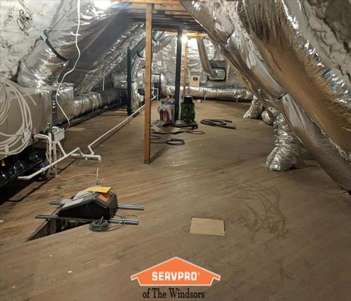 Attic-wood floors, ducting, mechanicals, insulation, heavy dust, SERVPRO logo